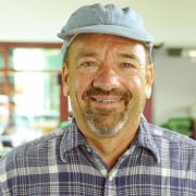 Man with salt-and-pepper mustache and goatee